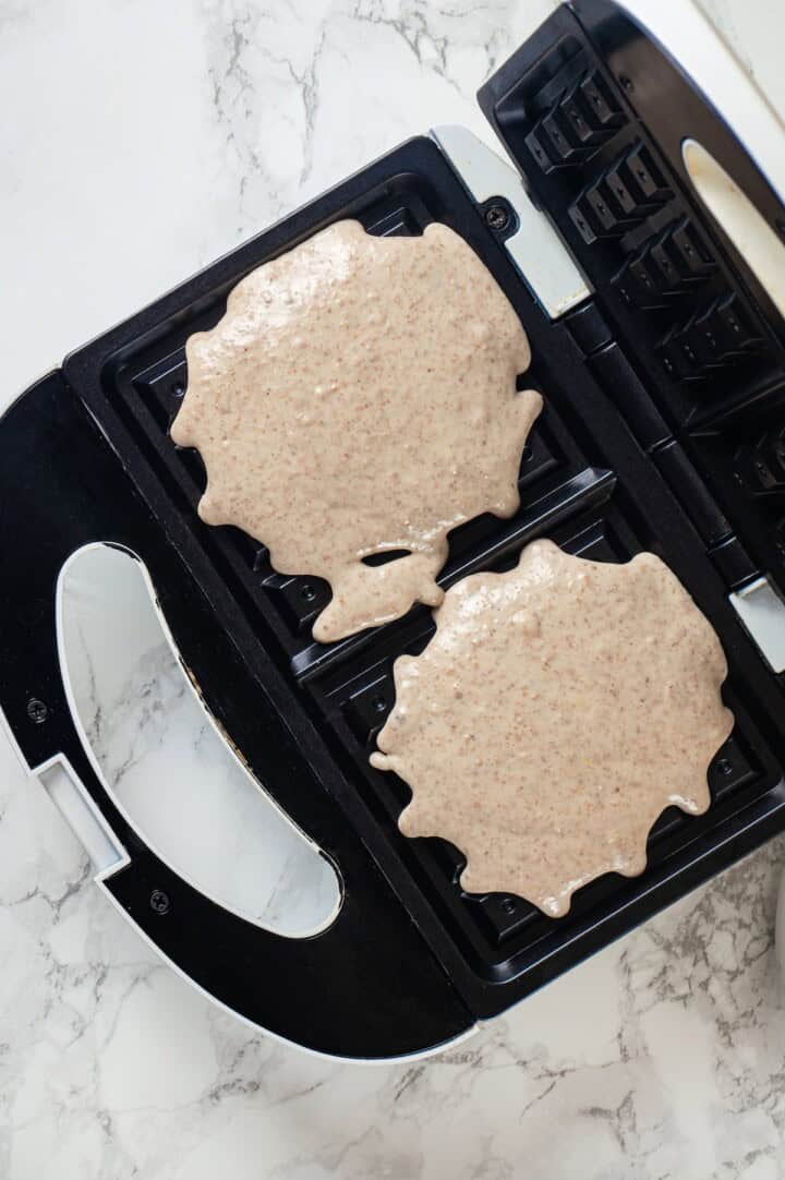 Overhead view of batter for protein waffles in waffle maker