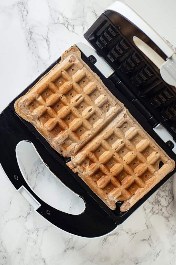 Overhead view of protein waffles in waffle maker