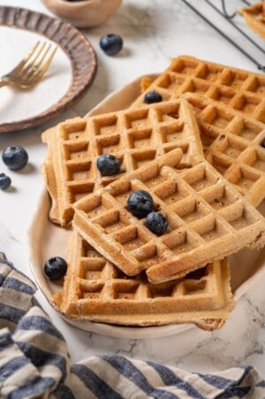Platter of protein waffles topped with blueberries