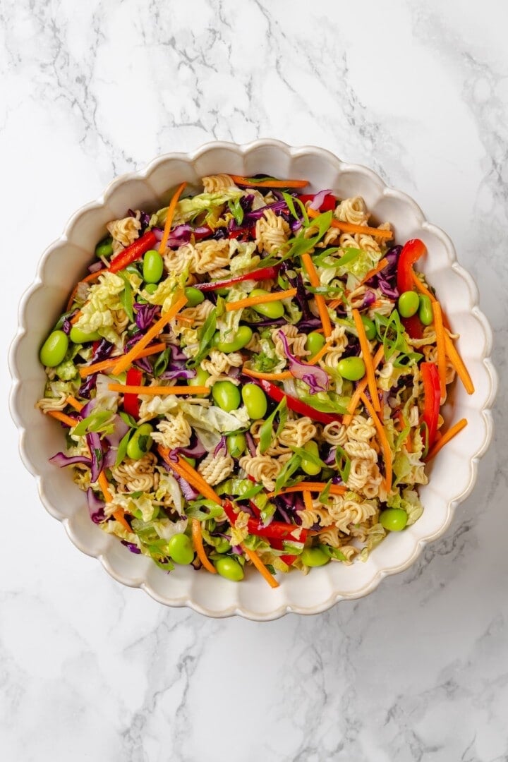 Overhead view of ramen noodle salad in bowl before adding toasted almonds