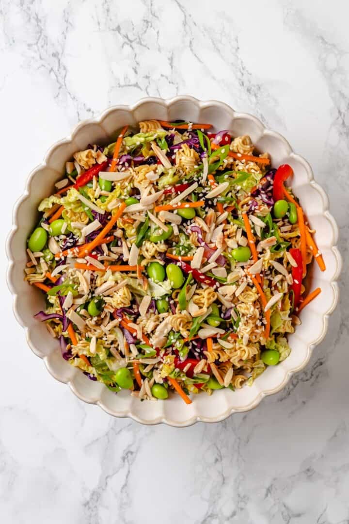 Overhead view of ramen noodle salad in mixing bowl