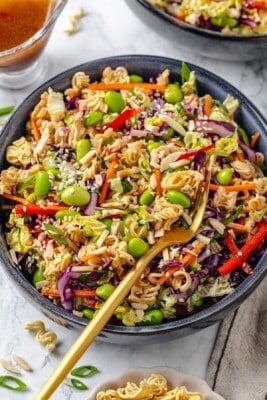 Overhead view of ramen noodle salad in bowl with fork