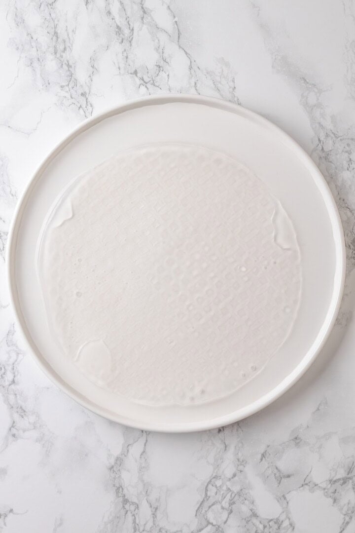 Rice paper is the secret for ultra crispy vegan bacon! This recipe is smoky, sweet, and savoury, and it's incredibly easy to make too. Soaking rice paper in water to soften it