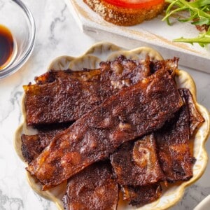 Bowl of crispy vegan bacon made with rice paper