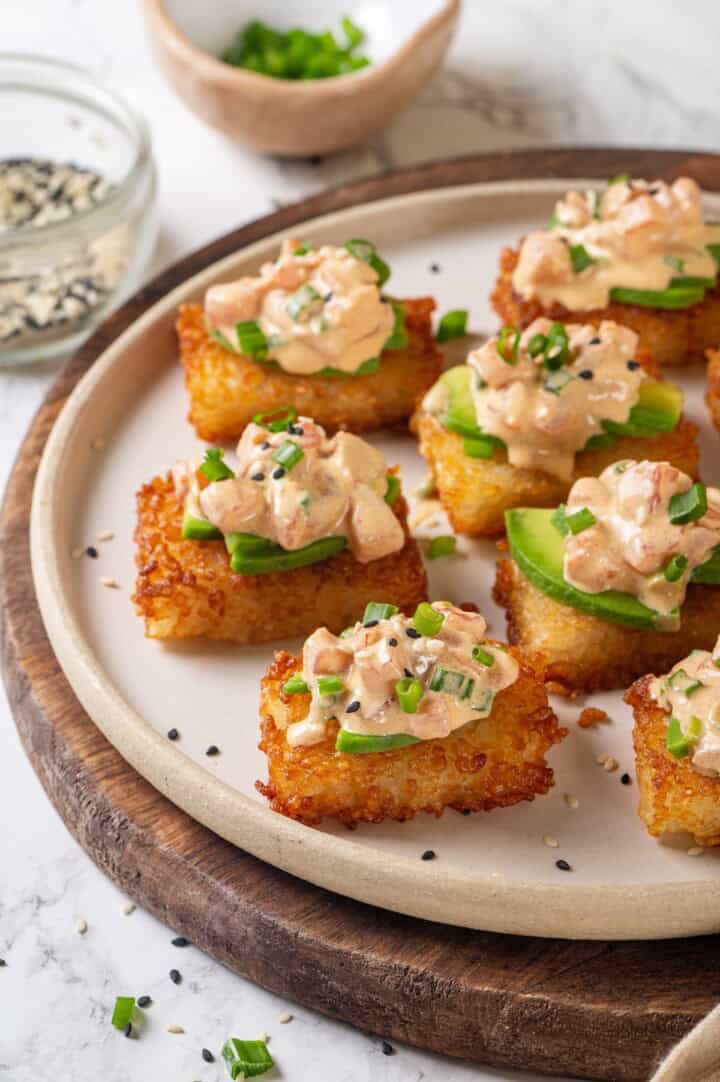 Plate of crispy rice cakes topped with vegan spicy tuna