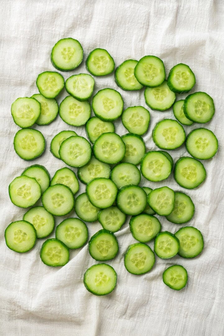 Overhead view of cucumber slices on towel