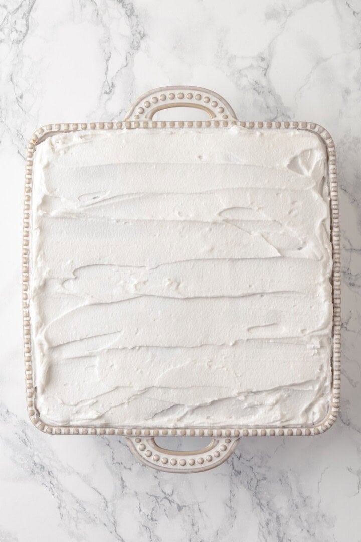 Overhead view of strawberry icebox cake before adding strawberries for garnish