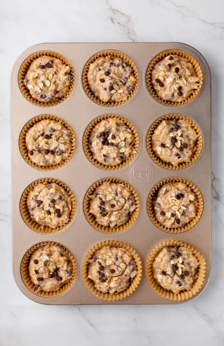 Overhead view of batter for banana oatmeal muffins in pan