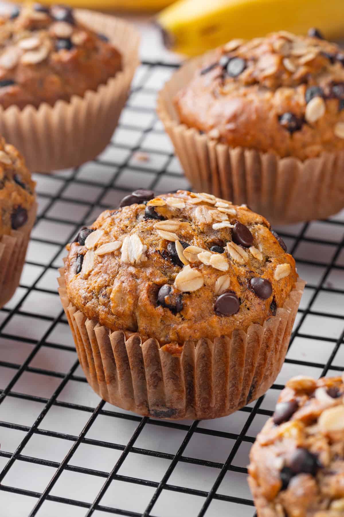Closeup of banana oatmeal muffin on wire rack