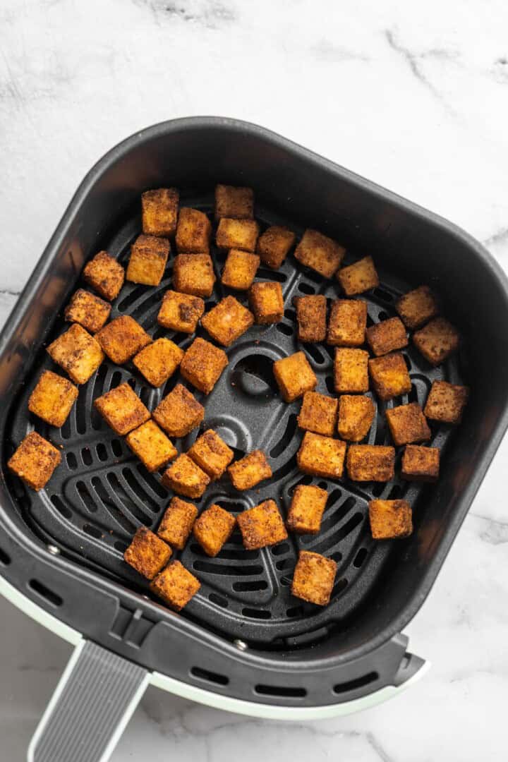 Overhead view of crispy tofu in air fryer