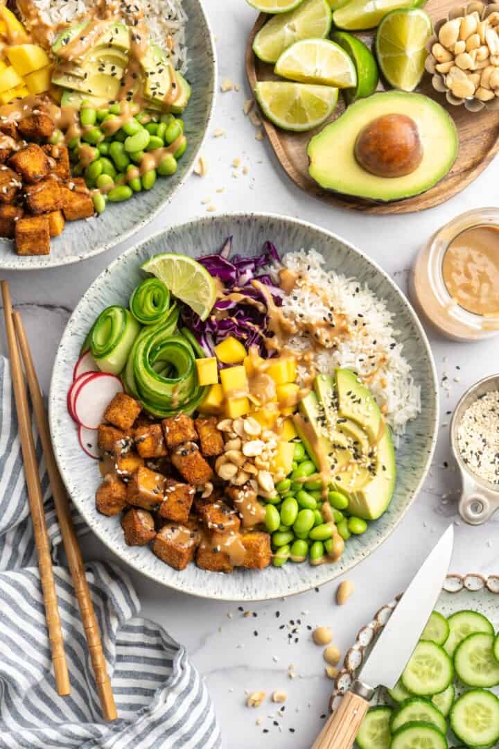 Overhead view of crispy peanut tofu bowl with veggies and rice