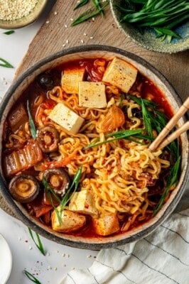 Overhead view of kimchi ramen in bowl with chopsticks