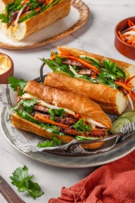 Two tofu banh mi sandwiches on plate