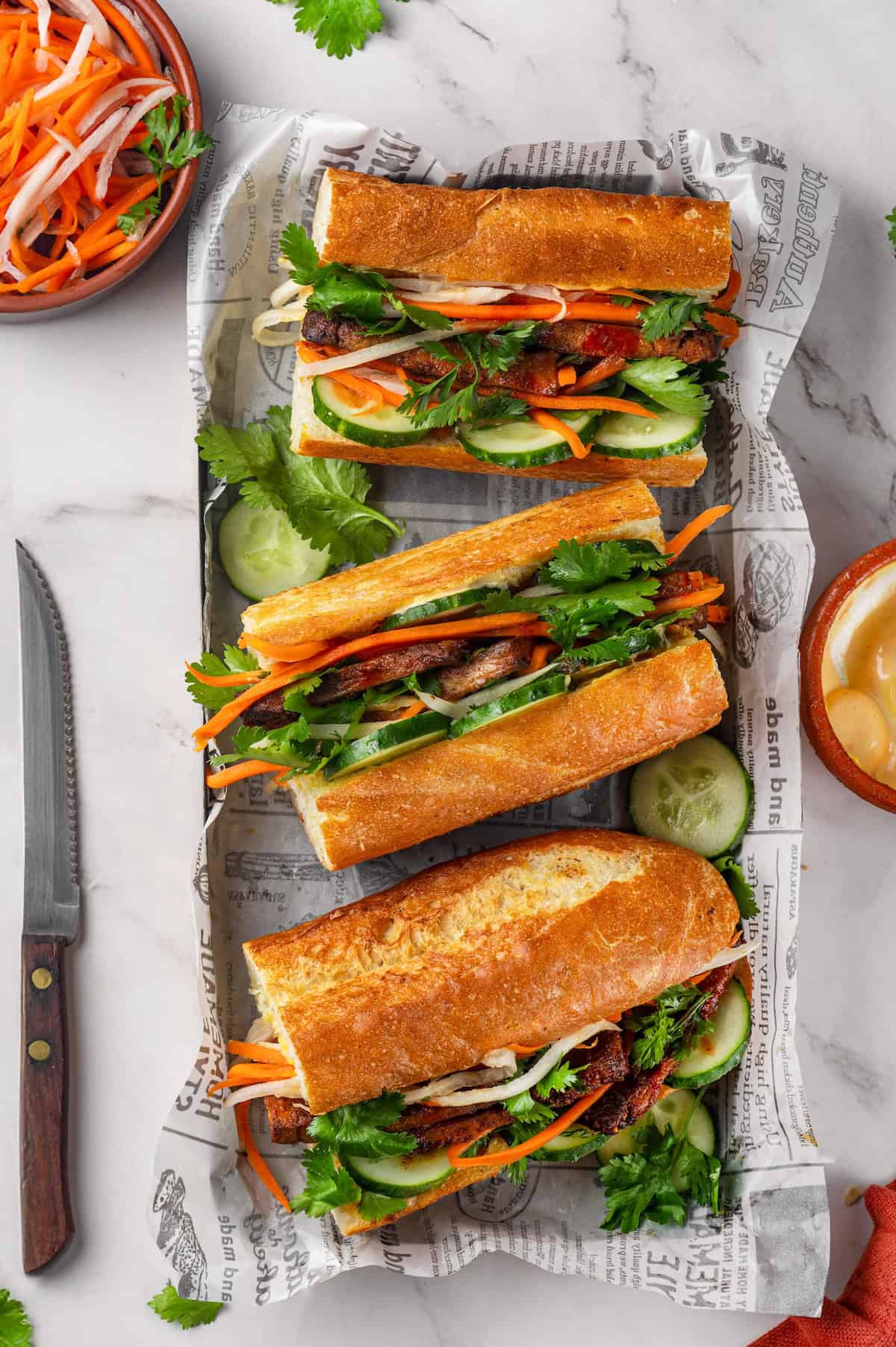 Overhead view of 3 tofu banh mi set in tray