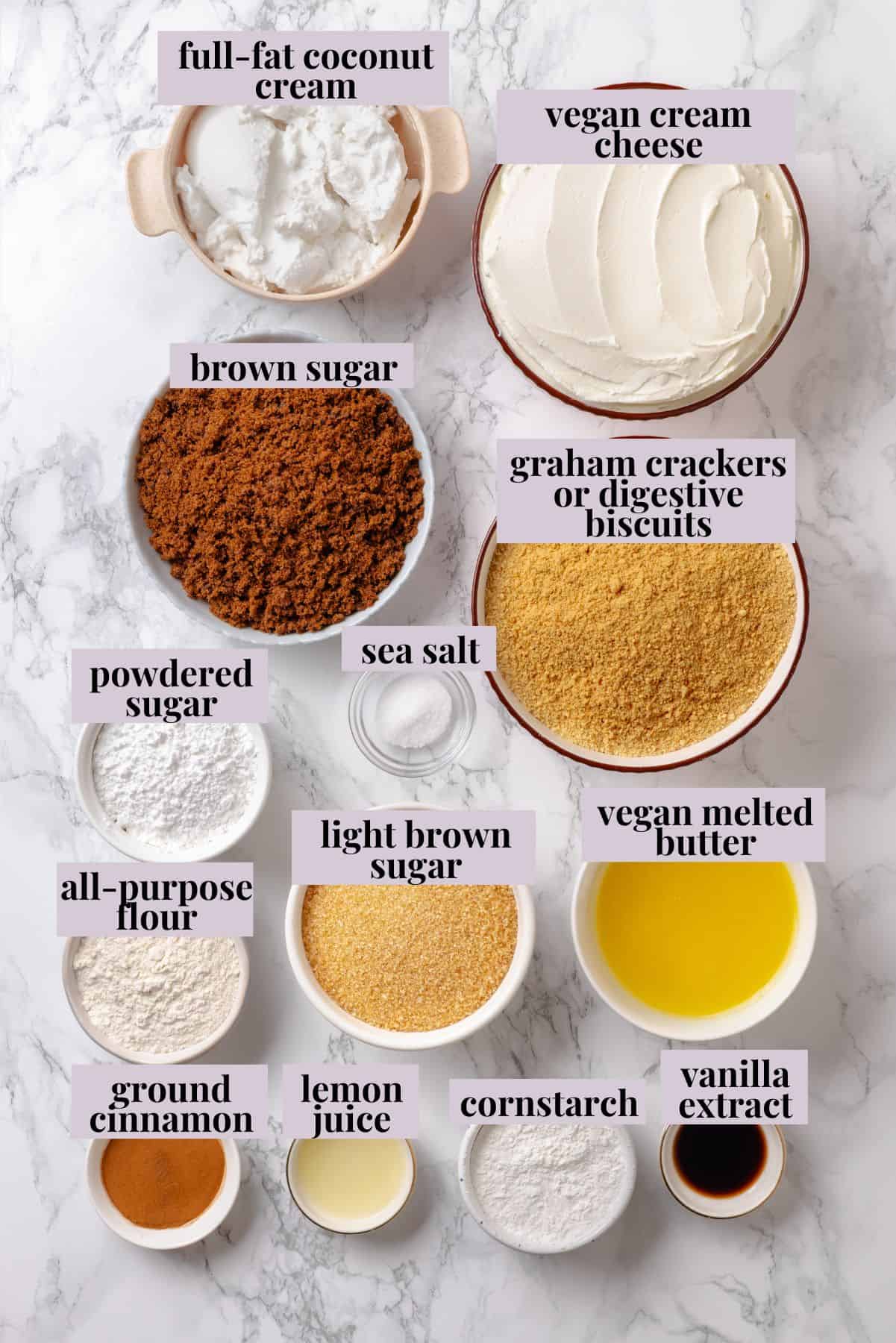 With a brown sugar cinnamon swirl and cream cheese frosting, this cinnamon roll cheesecake recipe is cozy and decadent at the same time! Overhead view of cinnamon roll cheesecake