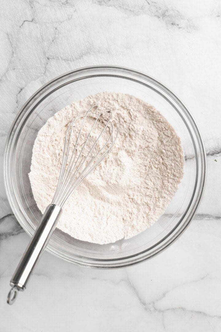 Mixing dry ingredients in a bowl.