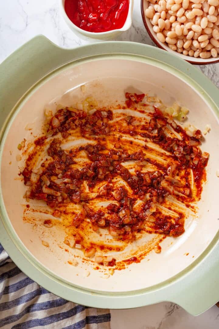 Overhead view of tomato paste cooking in pot