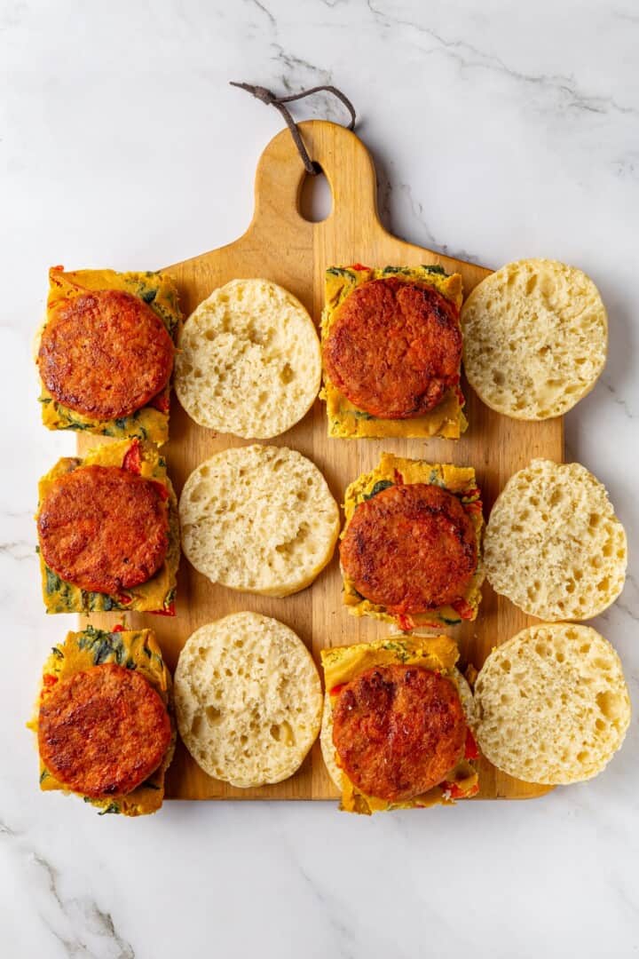 Overhead view of vegan sausage added to breakfast sandwiches
