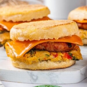 Vegan breakfast sandwich with omelet, sausage, and cheese
