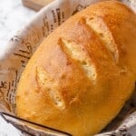 Whole French bread loaf in basket