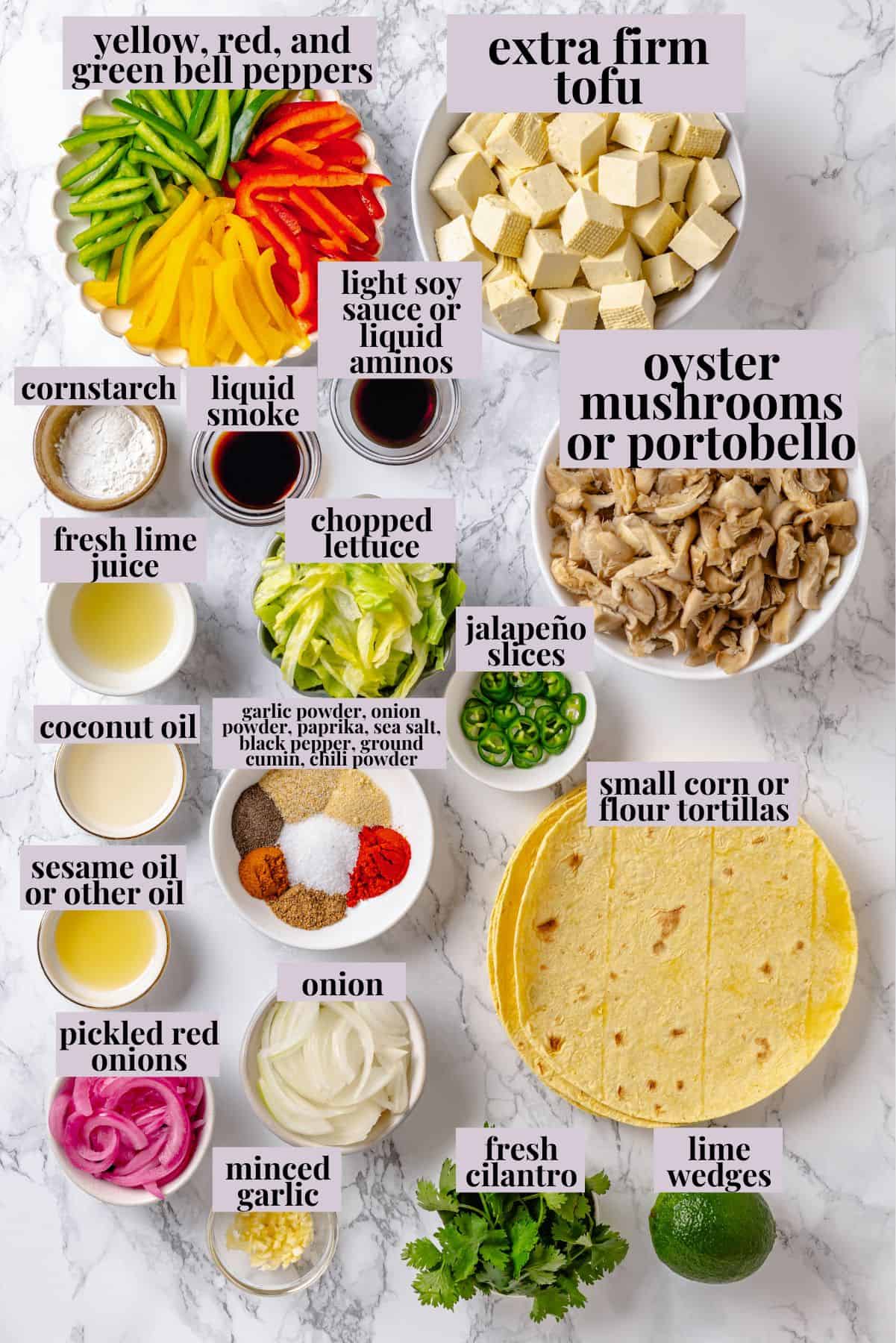 These crispy Tofu Tacos are topped with meaty fajita mushrooms and veggies for a vegan taco recipe that’s satisfying and delicious! Overhead view of ingredients for tofu tacos with fajita veggies