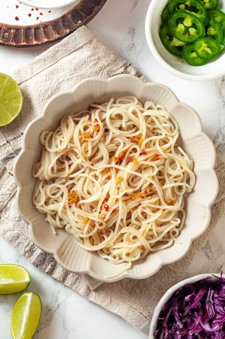 Noodles with nuoc cham sauce in bowl.