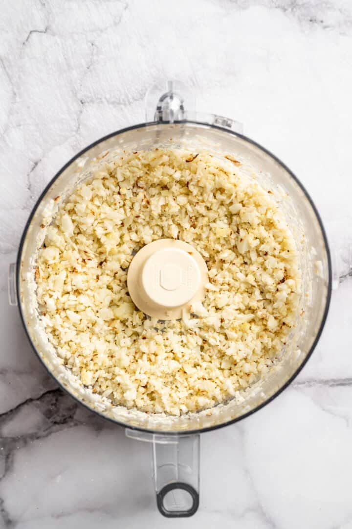 Chopped cauliflower in food processor.
