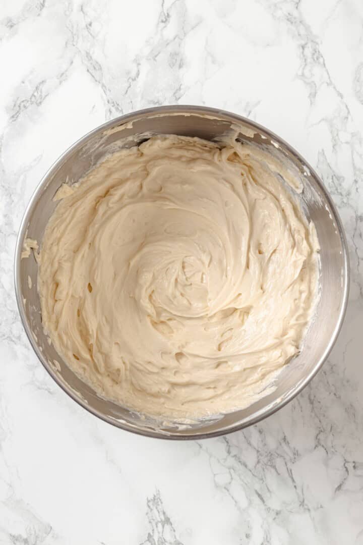 Beaten vegan cream cheese and brown sugar in bowl.