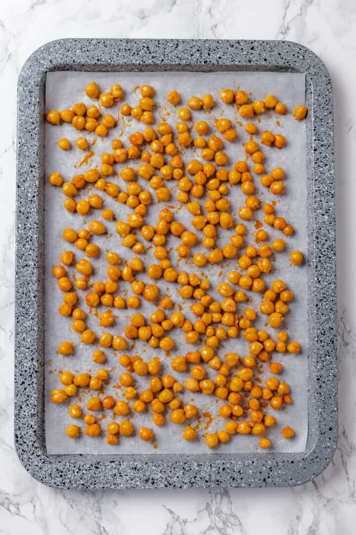 Seasoned chickpeas on sheet pan.