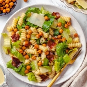 Caesar pasta salad on plate with fork.