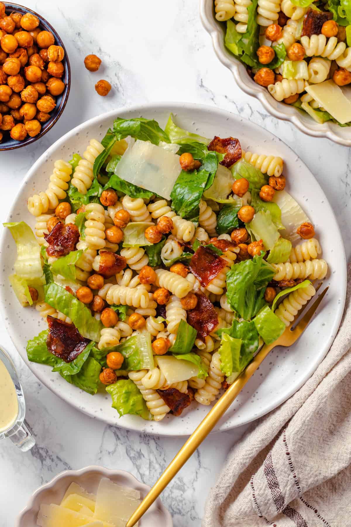 Caesar pasta salad on plate with fork.