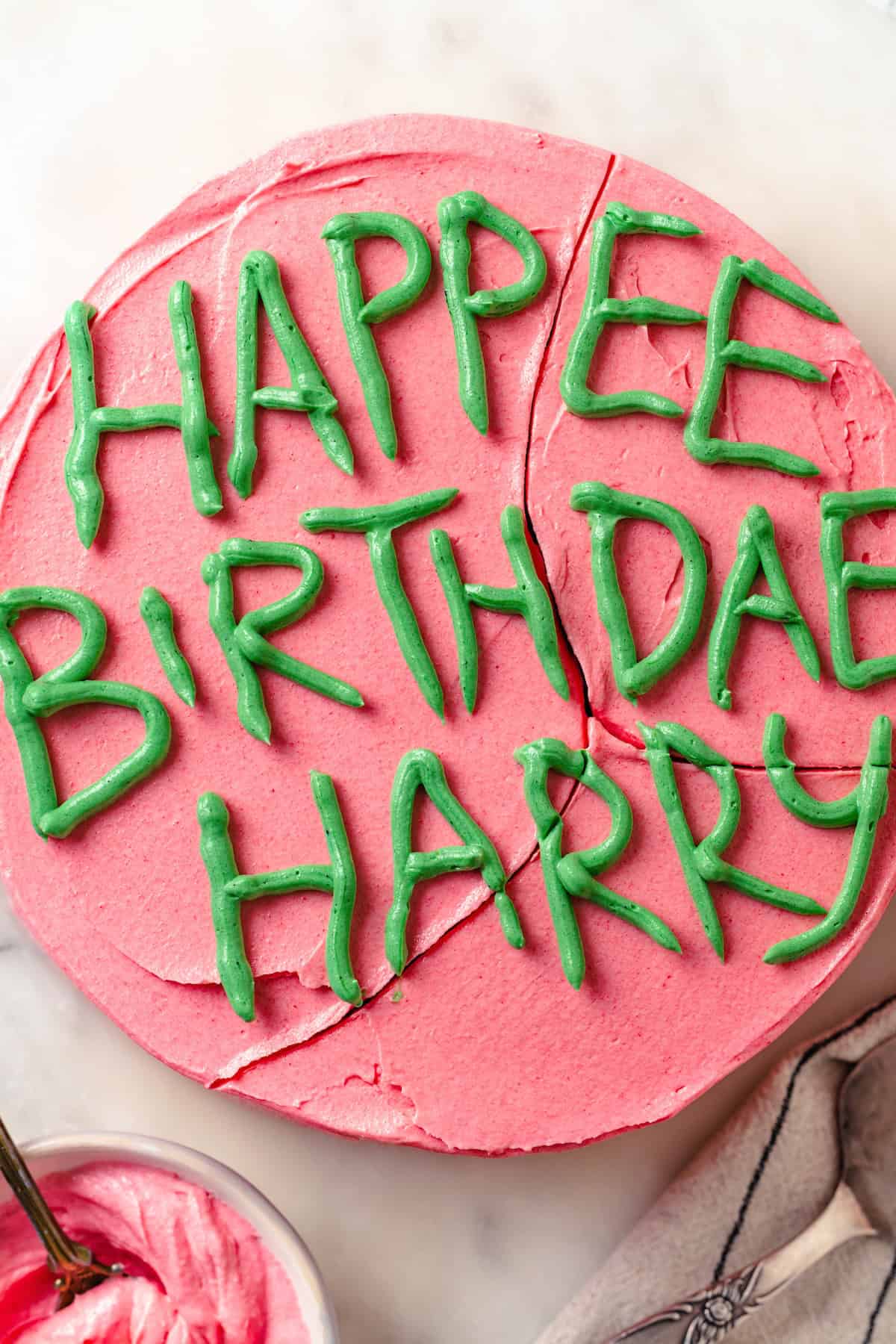 Hapee Birthdae Harry Potter cake with bowl of frosting.