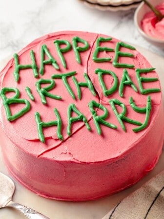 Homemade Harry Potter cake that reads Happee Birthdae Harry.