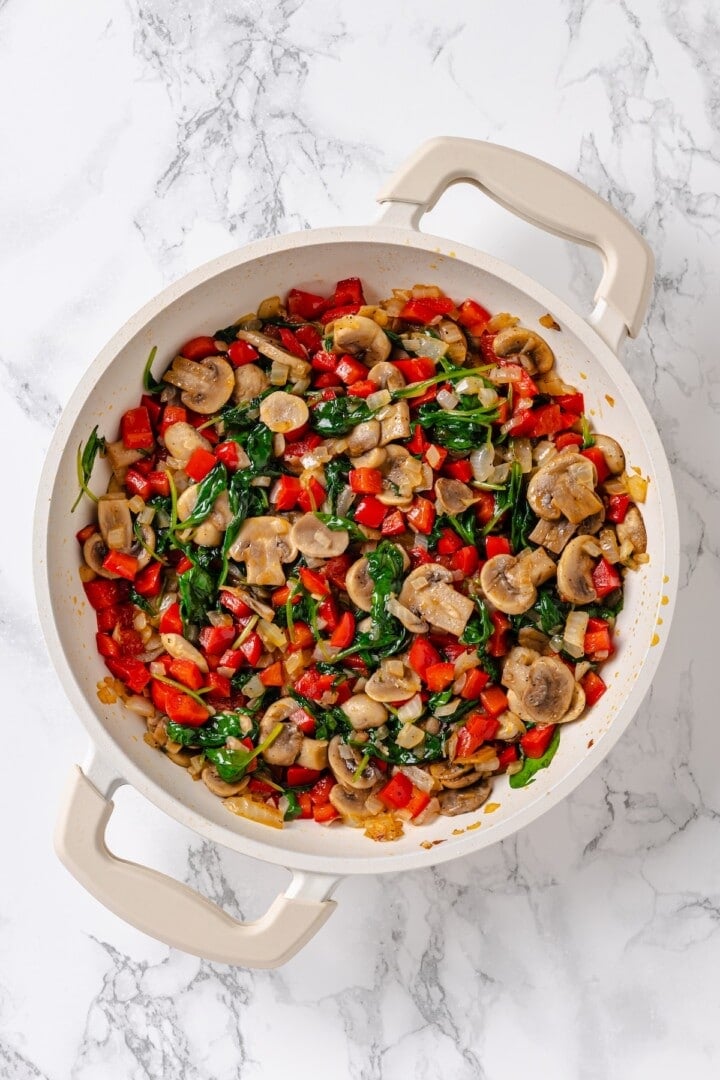 Overhead view of sauteed vegetables in pan