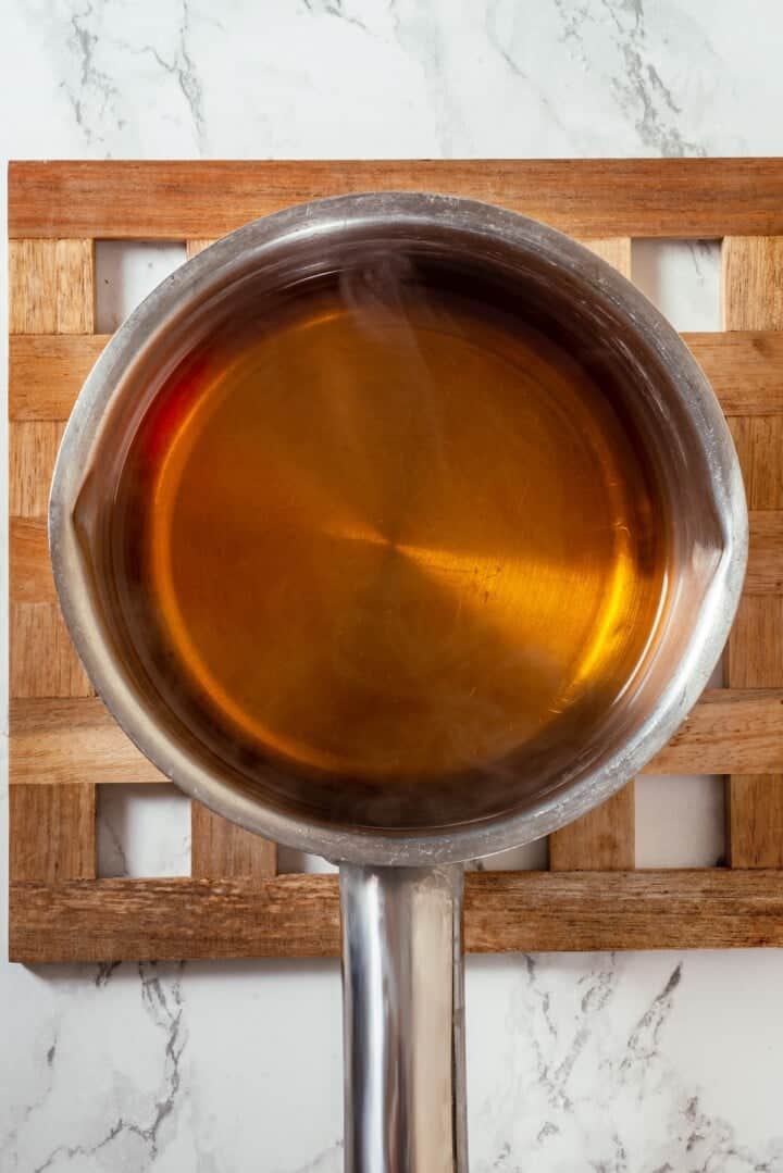 Apple cider in saucepan.