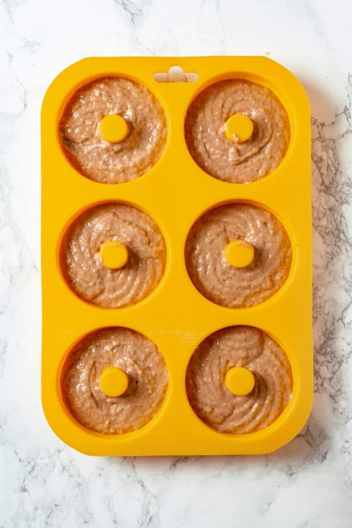 Batter for apple cider donuts in silicone pan.