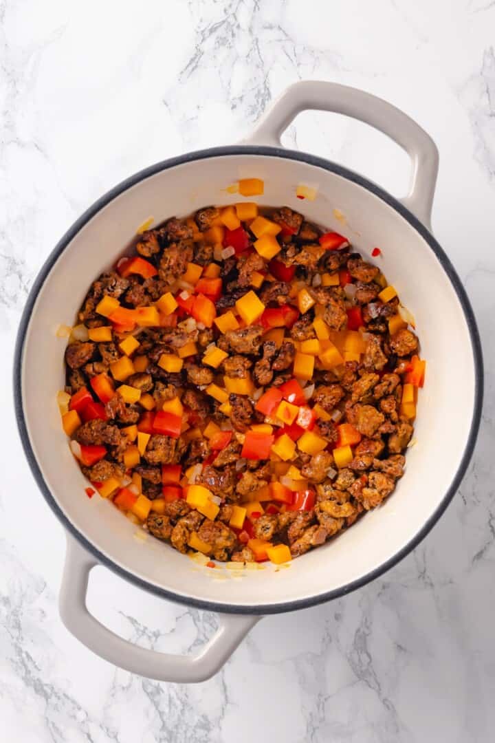 Vegetables and vegan ground beef in Dutch oven.