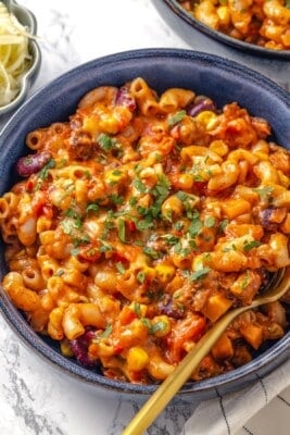 Bowl of vegan chili mac and cheese with fork.