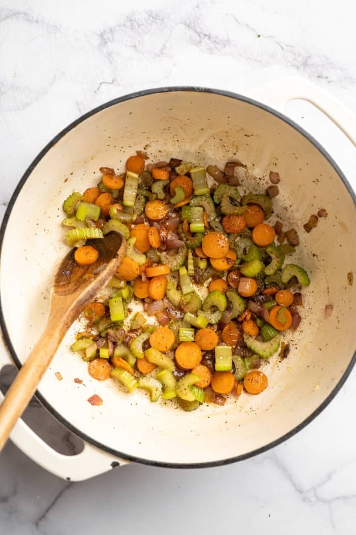 Eliminate waste and make a delicious dinner with this Broccoli Fridge Clean-Out Soup! Rich and creamy, with optional grilled cheese croutons. Mirepoix cooking in Dutch oven.