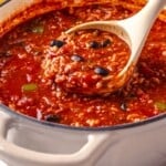 Ladle of vegan stuffed pepper soup.