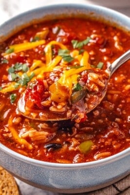 Spoonful of stuffed pepper soup in bowl.