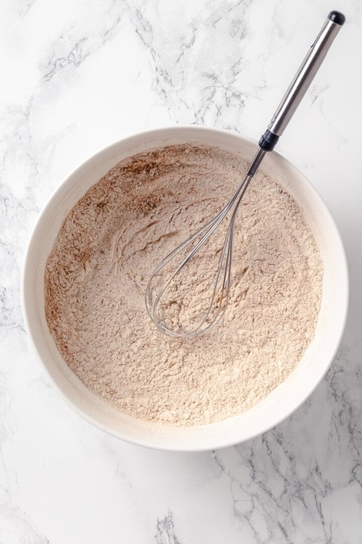 Bowl of dry ingredients with whisk.