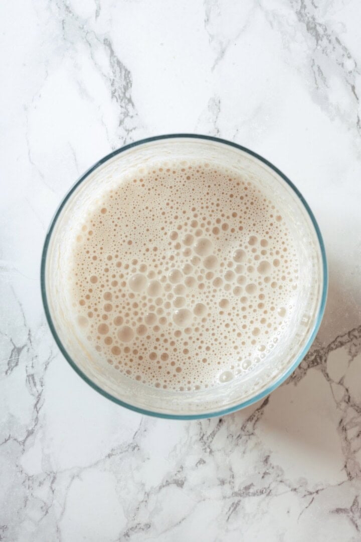 With sweet corn, tender potatoes and a creamy broth, this vegan Corn Chowder recipe is every bit as delicious as the traditional version! Cashew cream in bowl.