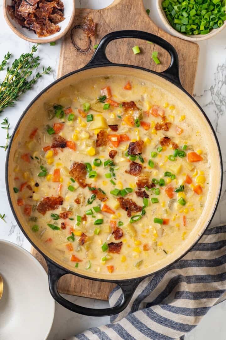 With sweet corn, tender potatoes and a creamy broth, this vegan Corn Chowder recipe is every bit as delicious as the traditional version! Vegan corn chowder in Dutch oven.