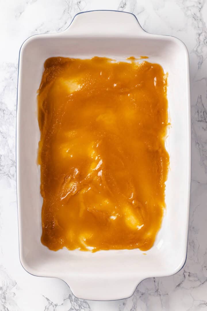 With a rich vegan custard and caramel, this Creme Brûlée French Toast has the flavour of the classic dessert in crowd-pleasing breakfast form! Caramel spread in bottom of baking dish.