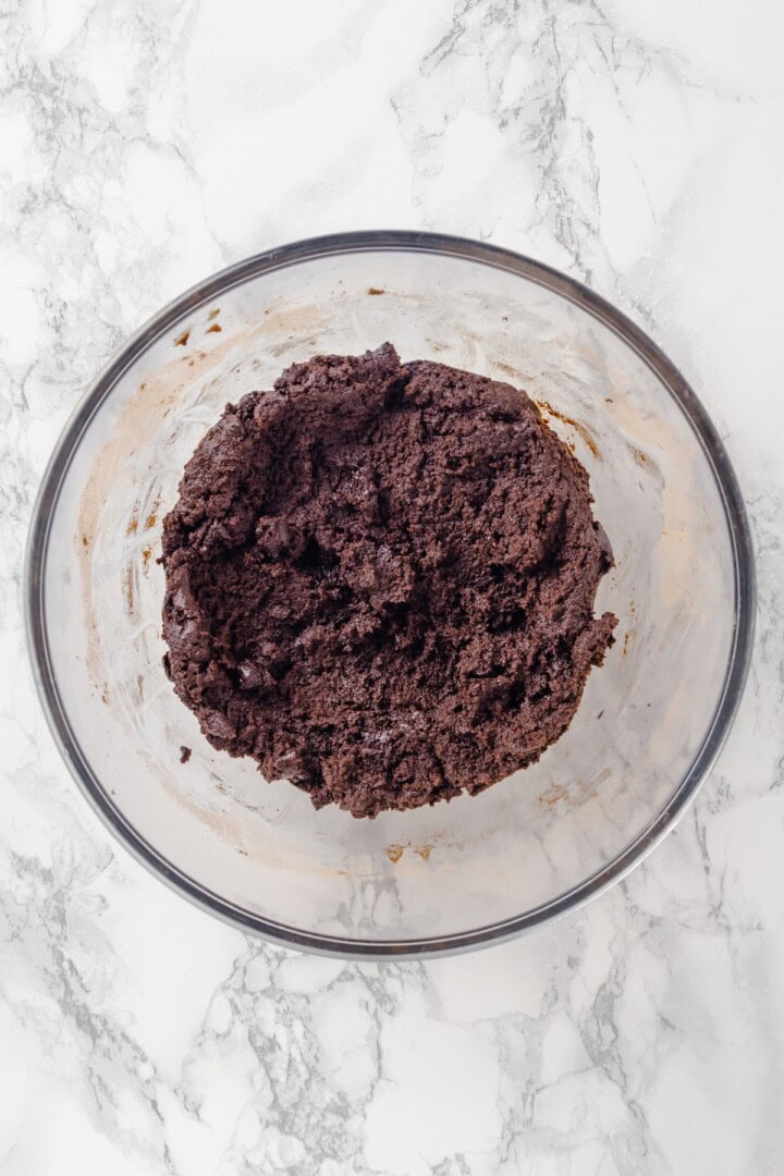 Hot chocolate cookie dough in glass bowl.