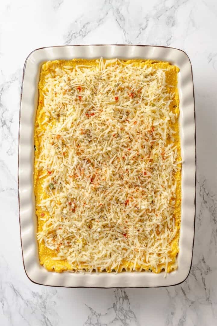 With layers of creamy squash, spinach ricotta and vegan cheese, this butternut squash lasagna is hearty, rich and full of cozy fall flavour! Vegan cheese added to top of butternut squash lasagna.