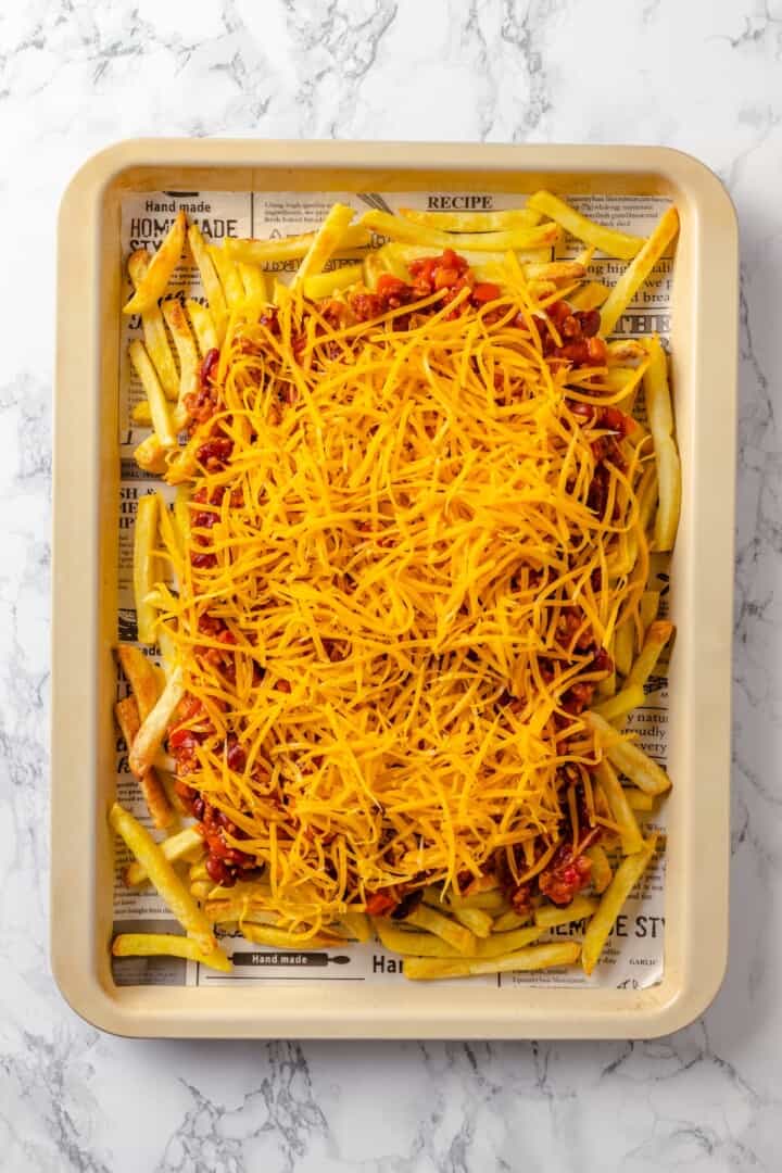 Vegan cheese added to chili fries.
