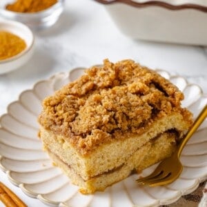 Slice of vegan coffee cake on plate with fork.