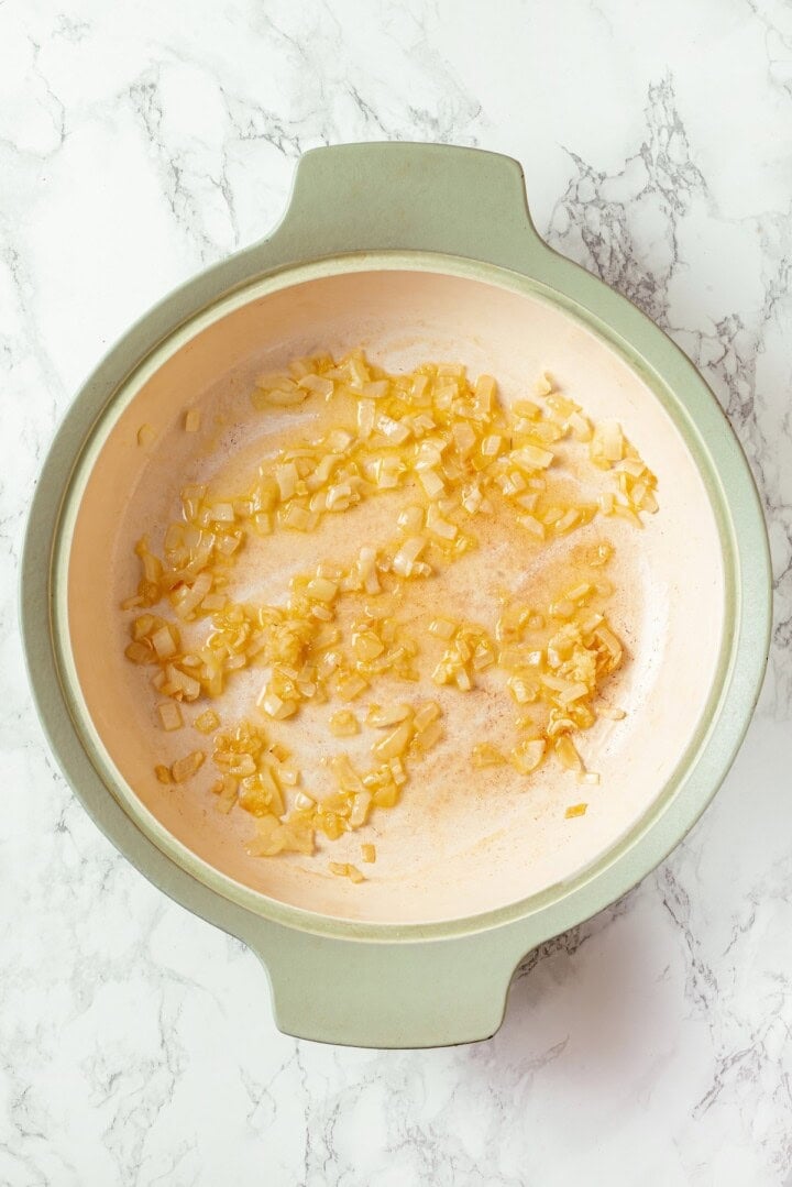 Onion and garlic cooking in skillet.